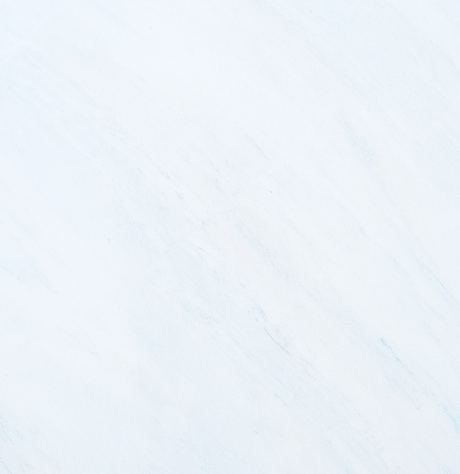 Light marble texture with subtle gray veining.